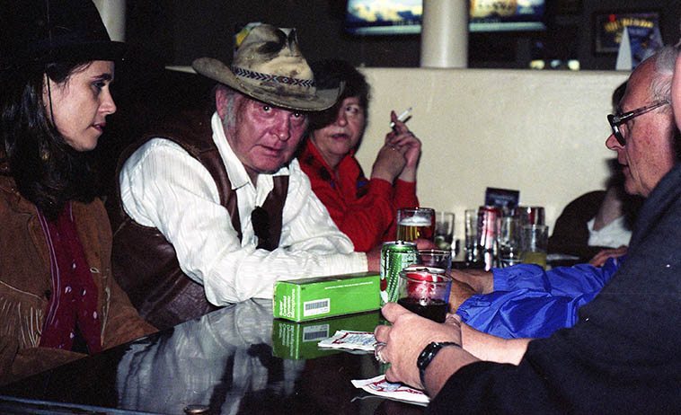 Kell Robertson at the Silver Dollar Saloon in Raton, New Mexico -- June 20, 1992 -- that's his wife Betsy with cig, and Mary Evans on his right, and Todd Moore across the table from him -- photo by Mark Weber